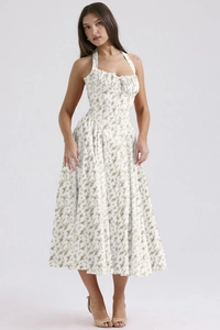 Detail of floral spaghetti strap maxi dress featuring lace trim and fitted waistline