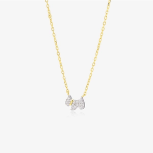 Close-up of S925 silver puppy necklace with gold chain and sparkling zircon pendant