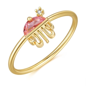 Detail of 18K gold ring with pink semi-round gem and jellyfish-like dangling tentacles