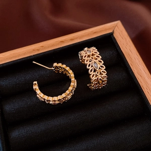 Detailed macro view of 18K gold plated wheat ear hoop earrings with sparkling zircon stones