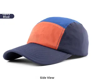 Side view of navy blue, orange, and royal blue 5-panel quick-dry sports cap with stitching