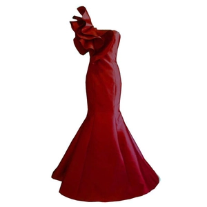 Elegant red one-shoulder evening gown with ruffled detail and fishtail hemline
