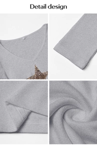 Detail design showing V-neckline with star patch and soft cotton fabric texture on grey T-shirt
