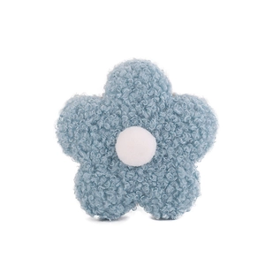 Detail of 8cm blue teddy velvet flower accessory with a white plush center and soft texture