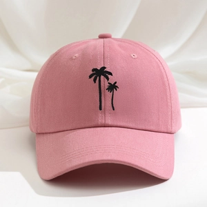 Pink cotton baseball cap featuring black palm tree embroidery with adjustable strap