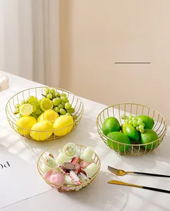 Three-piece set of gold wire iron fruit baskets in various sizes for stylish home storage