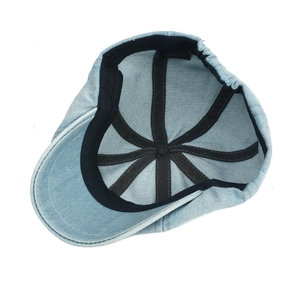 Internal structure of light blue denim ivy cap featuring 100% cotton wash label