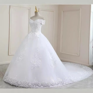Elegant off-shoulder wedding dress with intricate lace appliques and long bridal train