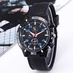 Men's black quartz sport watch with blue stitching and three-eye dial on a studio background