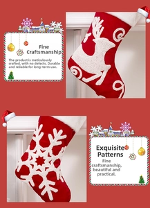 Detail of red velvet Christmas stocking with plush elk and snowflake embroidery
