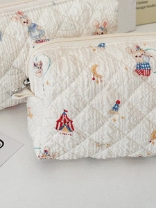 Quilted cotton cosmetic bag with cute circus rabbit print and zipper closure