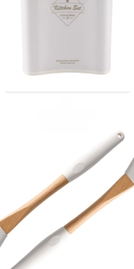 Close-up of premium wooden handles on white silicone kitchen utensils with storage bucket