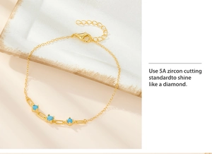 Detailed close-up of 925 silver gold bracelet with blue zircon stones and lobster clasp