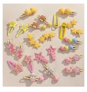 Flat lay macro of colorful Y2K hair clips featuring stars, bears, and rabbits for girls