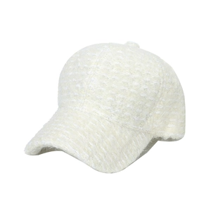 Minimalist white plush baseball cap featuring thick textured faux fur and curved brim