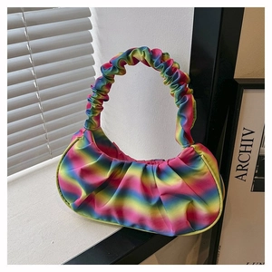 Detailed close-up of vibrant rainbow gradient pleated shoulder bag with soft satin texture