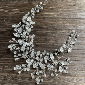 Detail of handcrafted silver wire bridal hair comb with sparkling crystals and rhinestones