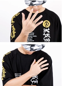 Close-up of dual-tone stainless steel watch band rings on male model hands