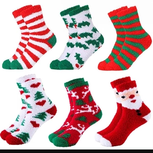 Detailed grid of six festive coral fleece Christmas socks in red, green, and white colors