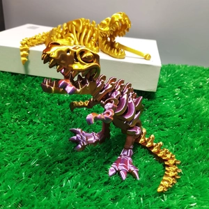 Detailed close-up of 3D printed T-Rex skull model with metallic purple and gold gradient finish