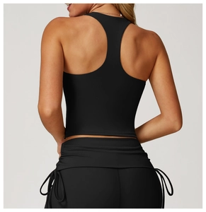 Detailed back view of a black racerback sports vest with moisture-wicking fabric texture