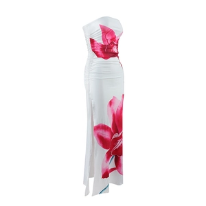 Detail of white tube maxi dress with red floral print, side ruching and leg slit