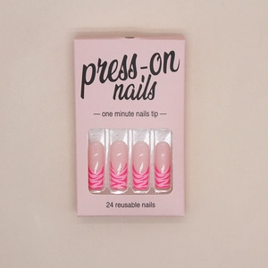 Detail of pink French zebra pattern press-on nails set in minimalist window gift box