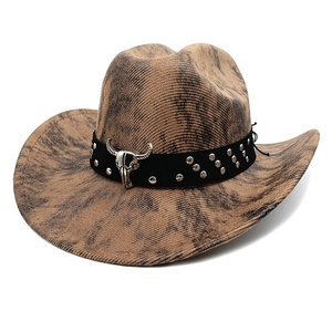 Detailed macro view of the western cowboy hat with metal bull head skull and silver rivets