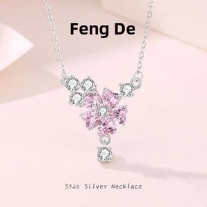 Close-up of S925 silver necklace with pink heart-shaped zircon flower pendant