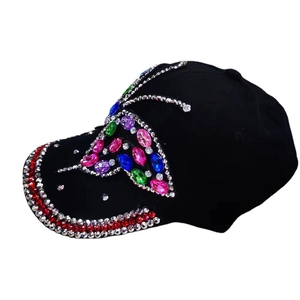 Fashionable black denim baseball cap with colorful rhinestone butterfly patterns on white background