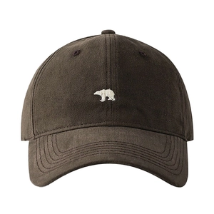 Deep brown cotton baseball cap featuring a white polar bear embroidery and curved brim