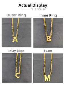 Detailed views of 18K gold plated A, B, C, M alphabet pendants on Cuban curb chain links