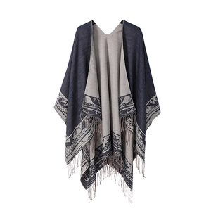 Double-sided poncho in dark blue and light grey with striped borders and fringe trim