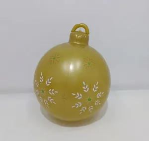 Close-up of a 60cm gold PVC inflatable Christmas ball with white snowflake patterns