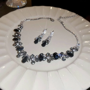 Exquisite French vintage necklace and earrings set with black teardrop crystals and starbursts