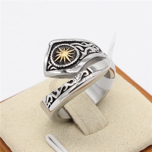 Vintage stainless steel signet ring with golden sunburst star and celtic pattern