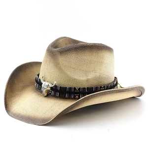 Western straw cowboy hat with ethnic band and silver bull head detail for sun protection
