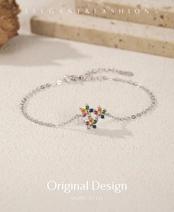 Detail of S925 silver bracelet with multi-color zircon stars and elegant lobster clasp