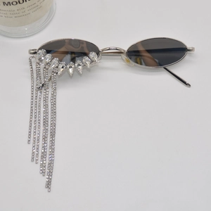 Chic oval sunglasses with silver frames and sparkling rhinestone fringe tassels