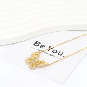 Detail of butterfly necklace with yellow pear-cut zircon and gold-plated titanium steel chain