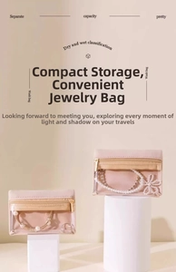 Pink velvet jewelry organizer with transparent window and gold zipper on white pillars