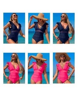 Detail of ruffled shoulders and sheer mesh waist on deep blue and pink nylon swimwear