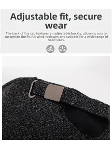 Detail of adjustable metal buckle on dark grey knit winter cap for secure and custom fit