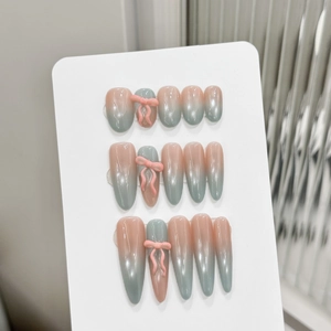 Pink and blue gradient press-on nails with 3D bows in short round and long coffin shapes