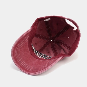 Internal view of a washed cotton baseball cap with 100% cotton label and metal buckle
