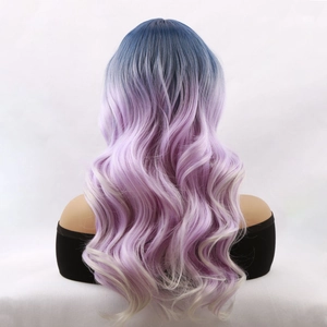 Long wavy purple ombre synthetic wig with blue roots on model, high-quality hairpiece