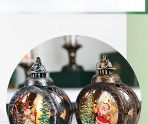 Detail of vintage Christmas lanterns with Santa Claus and Snowman LED candle scenes