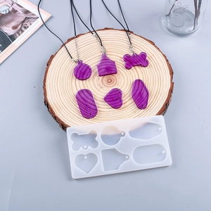 Detail of 6-hole geometric silicone mold for resin pendants and wood texture charms
