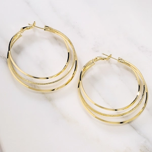 Minimalist 18K gold plated multi-layer geometric hoop earrings on marble surface