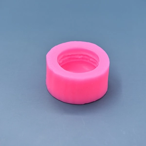 Detailed view of pink silicone mold with inner threading for soap and candle making